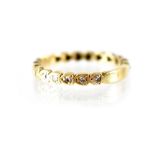 An 18ct gold and diamond full eternity ring, the Gypsy-set diamonds in heart-shaped mount,