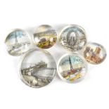 Six antique and vintage picture back clear glass paperweights to include 'Gigantic Wheel Blackpool',