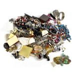 A large bag of various costume jewellery and a small bag of Oriental inspired jewellery to include