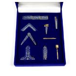 Modern Masonic 'Working Tools' lapel set with blue enamel on gold plate, in presentation box.