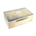 An Edwardian, hallmarked silver cigarette box with soft wood liner (lacking partition),