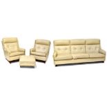 A 1960s three-piece suite comprising a three-seat settee, length 214cm,