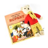 A c1970s 'Rupert the Bear' figure and a Rupert related book 'Lots of Fun to Cook with Rupert',