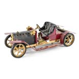 A Mamod live steam Roadster car with burgundy and black body, with burner tray, lacking box,