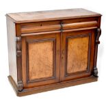 A Victorian mahogany chiffonier comprising a pair of drawers above cupboard doors,