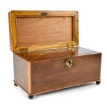 A 19th century mahogany tea caddy of rectangular form with boxwood stringing,