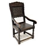 A 17th century carved oak Wainscot armchair,