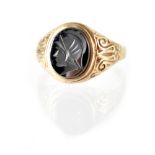 A gentlemen's vintage hallmarked 9ct gold intaglio seal signet ring with the head of a gladiator