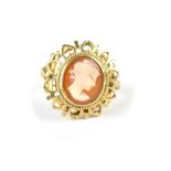 A hallmarked 9ct gold cameo ring, the central cameo of a lady within a border of small love hearts,