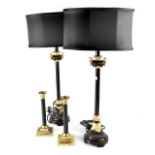 A pair of Napoleonic-style black and gilt-heightened column table lamps,