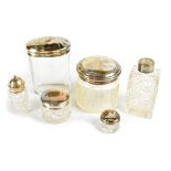 Six hallmarked silver topped and collared cut glass jars, various marks (6).