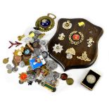 Various modern and vintage military and police buttons and badges to include enamelled City of