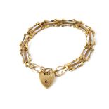 A 19th century hallmarked 9ct gold gate bracelet with 9ct gold heart clasp, length 16cm, approx 7.
