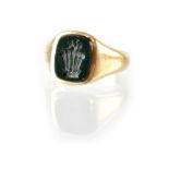 A gentlemen's hallmarked 9ct gold signet ring with heraldic crest intaglio depicting a crown with