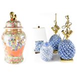 A pair of Oriental-style blue gilt-heightened pineapple table lamps, each on a gilded square base,