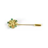 An 18ct gold flower head tie pin,