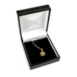 A 9ct yellow gold star pendant set with six small white stones, on a fine white metal chain,