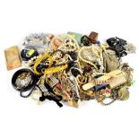 A large bag of costume jewellery to include fashion rings, various silver rings, brooches, bangles,