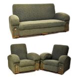 An Art Deco three piece suite comprising a two seat sofa, length 174cm, and a pair of armchairs,