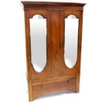 An Edwardian inlaid mahogany double wardrobe with a pair of mirrored doors above a single drawer,