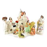 Six late 19th/early 20th century Staffordshire figures to include two non-matching courting couples,