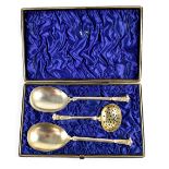 A Victorian cased set of three silver gilt anointing spoons, Hilliard & Thomason, Birmingham 1882,