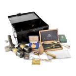 An ARP metal First Aid box containing mixed curios to include technical drawing set, Zippo lighter,