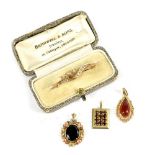 A 9ct yellow gold bar brooch set with seed pearls, three yellow metal pendants, one marked 10k,