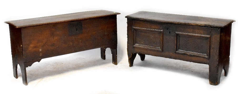 A small slim 18th century oak coffer with two faux front panels with carved arches,