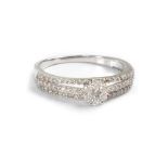 A 9ct white gold triple band ring set with central white diamond floral-set with small diamond