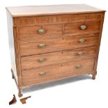 A George III mahogany chest of two short over three long graduated drawers,
