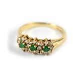 A diamond and emerald 9ct gold ring,