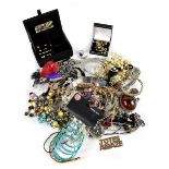 A large quantity of contemporary costume jewellery to include chains, link chain necklaces, rings,