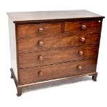 A Regency mahogany chest of two short over three long drawers, turned handles, on bracket feet.