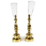 A pair of modern large brass table lamps in the antique French style,
