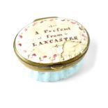 A 19th century oval enamel pill box, the lid inscribed 'A Present from Lancaster',