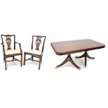 A reproduction mahogany extending dining table with one extra leaf, on twin pedestal base,