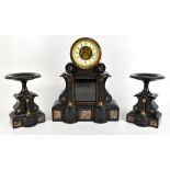 L MARTI; a French Victorian black slate and marble three piece clock garniture, the clock with