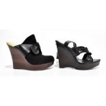 YVES SAINT LAUREN; a pair of black crossover sandals with a 12cm wedged heel and 4cm platform,