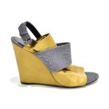 BALENCIAGA; a pair of beige and grey textured calf leather wedged sandals with an open toe, sling