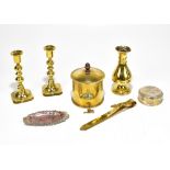 A small group of metalware, including a trench art tobacco jar, small pair of candlesticks, baluster