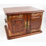 A late 19th/early 20th century mahogany cutlery cabinet with applied brass detail and twin