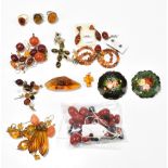 A group of predominantly amber and also amber coloured jewellery including three rings, various