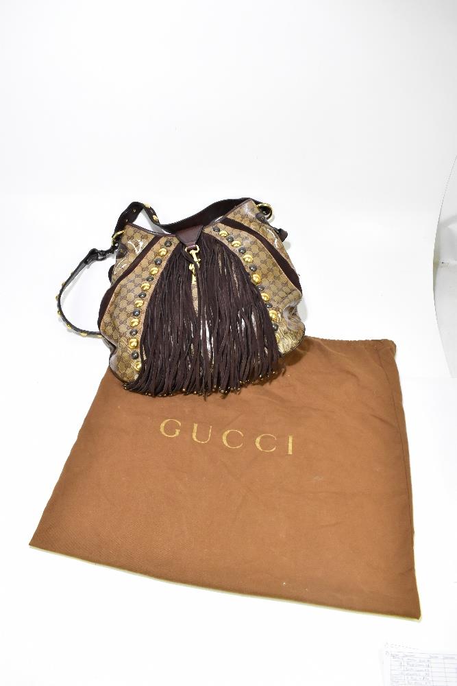 GUCCI; a large monogram cloth handbag with brown suede and leather hand and shoulder straps, - Image 9 of 9