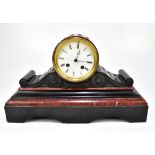 A late 19th century French rouge marble and black slate mantel clock, the white enamelled dial set