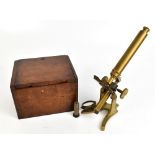 A late 19th/early 20th century brass monocular microscope, unsigned, height 28cm, with associated (