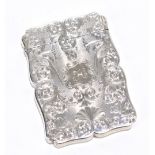 NATHANIEL MILLS; a Victorian hallmarked silver card case with chased decoration surrounding