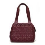 CHANEL; a vintage red caviar leather quilted small tote bag with two handles, two slip pockets lined