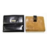 GUCCI; a black leather wallet/purse with a front flap pocket for coins and a back press-stud opening