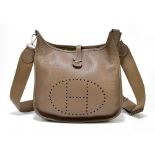 HERMÈS; a circa 2011 taupe clemency leather 'Taurillion Clemence Evelyne PM' shoulder bag with